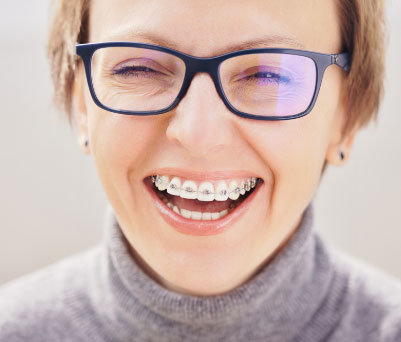 Adult laughing with Braces